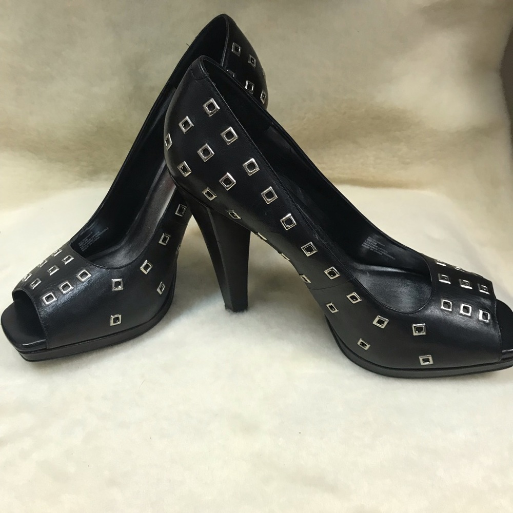 Black pumps with silver square studs